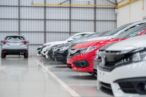 A row of cars stored in a warehouse